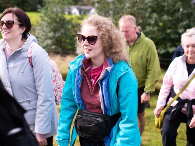 Two girls walking up a hill